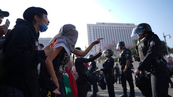 "U.S. Marines Make History by Detaining First Civilian Protester Amid Nationwide Demonstrations in LA" 6 LA rioter, law enforcement stand off